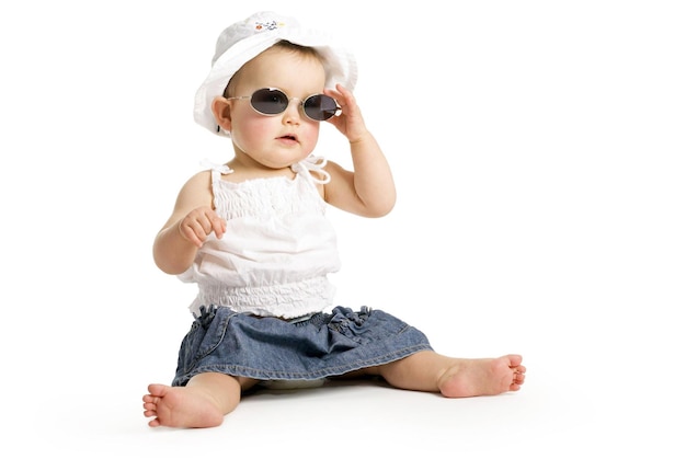 9 month baby girl in summer dress and sunglasses