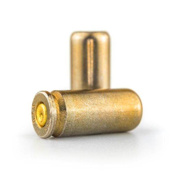 9mm pistol bullet on white background, close-up and high detailed photo