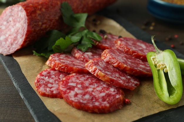 ÃÂ¡oncept of tasty food with salami sausage, close up