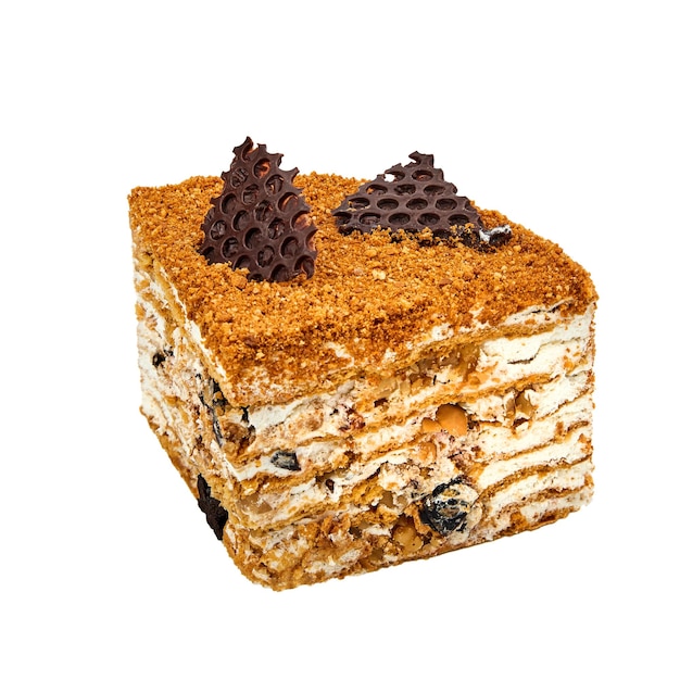 写真 ハチミツのケーキとメドビックのケーキの1枚 酸っぱいクリームプルーンとホワイトに分離されたナッツ