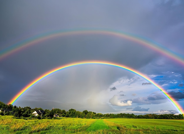 a_rainbow_in_the_sky_over_a_field