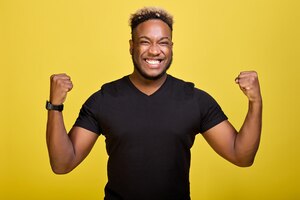 a tough black guy rejoices in his victory in competitions