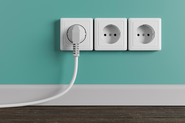 Фото Белая электрическая розетка на стене в комнате. электрическая вилка с кабелем в розетке.