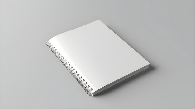 사진 나선형으로 묶인 표지가 있는 흰색 나선형 노트북입니다.