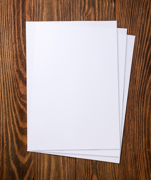 A4 paper sheets on a wooden background