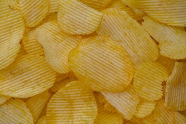 Aardappelchips snack als achtergrond afbeelding textuur achtergrond Kopieer lege ruimte voor tekst 1