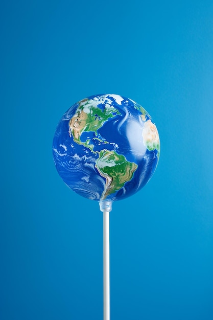 Aarde lolly snoep wereld Klimaatverandering en ecologie werelderfgoed zomer en reisconcept minimaal idee voor de opwarming van de aarde Save the planet poster