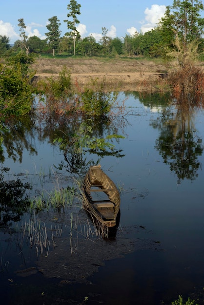 Abandoned boat in lake against sky