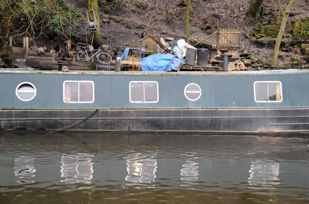 Abandoned boat moored in lake