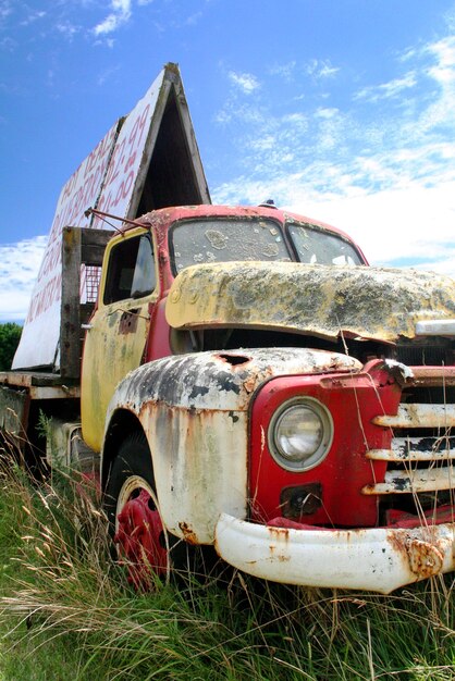 abandoned car on field