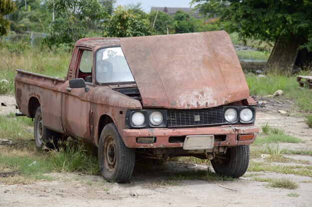 Abandoned car on field