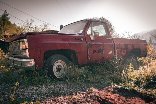 Abandoned car on field