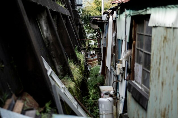 Abandoned house amidst buildings