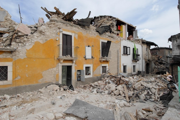 abandoned house by building against sky