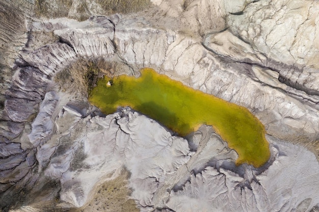 Abandoned industrial mining area Drone view of opencast mine filled with water Aerial shot of artificial lake