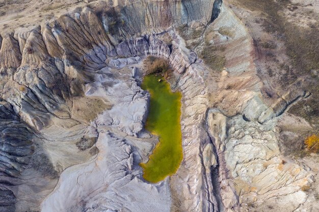 Abandoned industrial mining area opencast mine filled with water Aerial shot of artificial lake