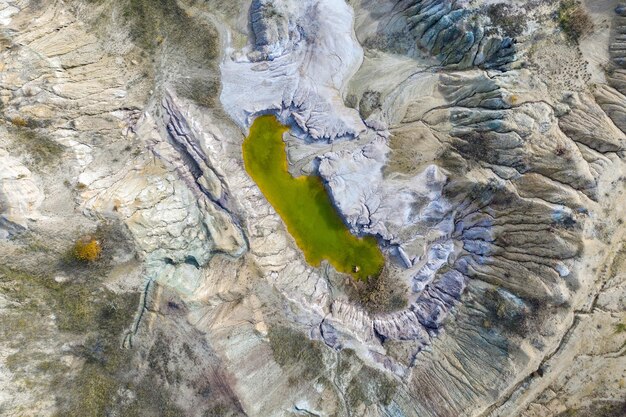 Abandoned industrial mining area of opencast mine filled with water Aerial shot of artificial lake