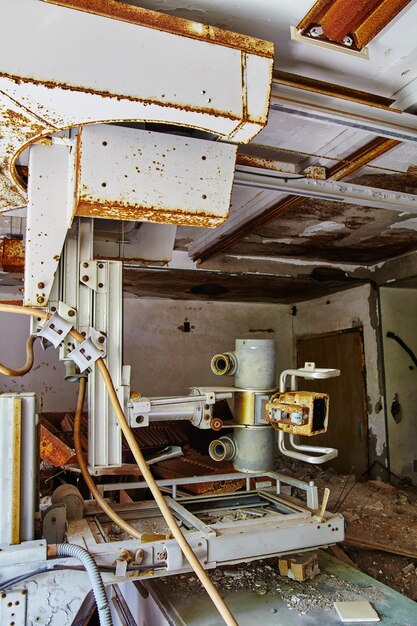 Photo abandoned medical facility with decaying xray machine urban decay