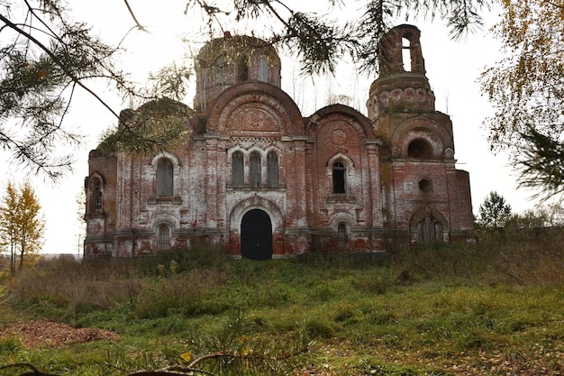 Abandoned red brick Christian church in depths of Russia abandoned building in wilderness