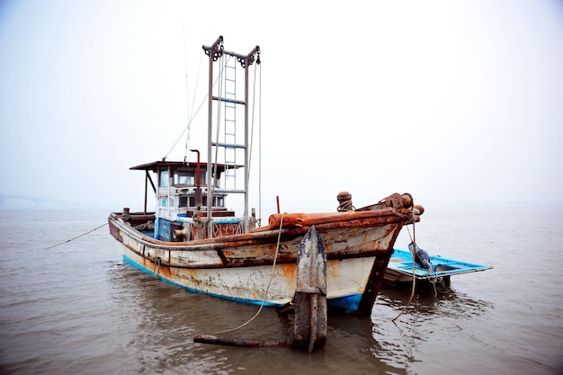 abandoned ship on sea against clear sky