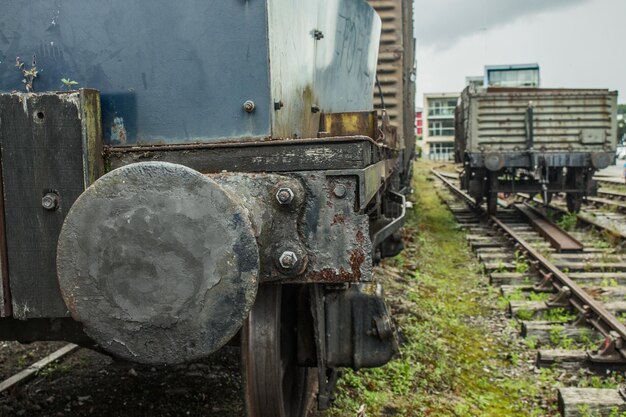 Abandoned train on railroad track against sky