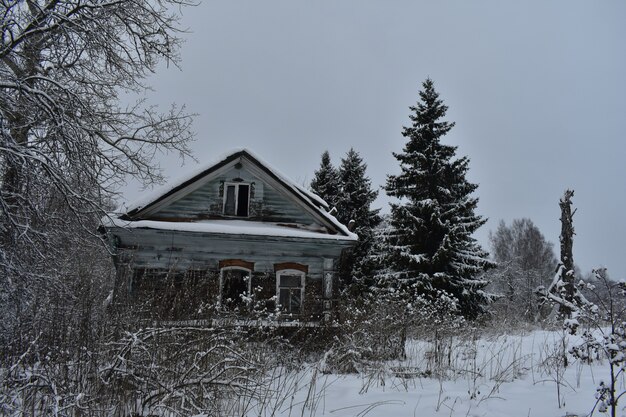 Abandoned village in the snow in winter
