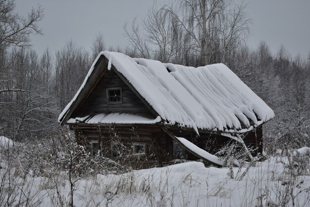 Abandoned village in the snow in winter