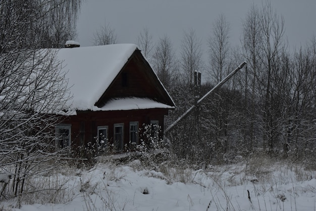 Abandoned village in the snow in winter