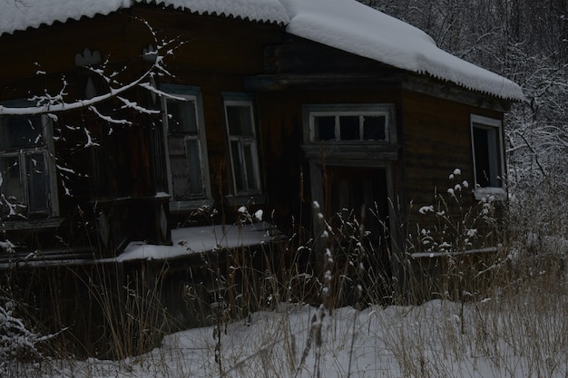 Abandoned village in the snow in winter