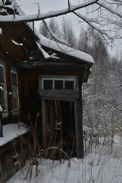 Abandoned village in the snow in winter