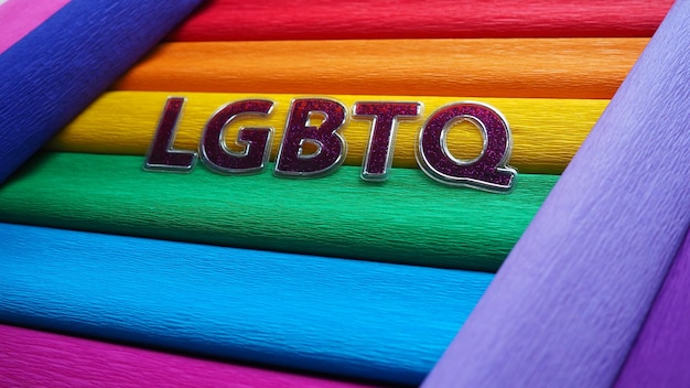 Photo abbreviation lgbtq letter text purple lgbtq lettering on the background of the rainbow flag