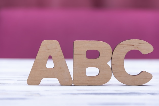 ABC letters on white wooden background. Education concept. Free copy space.