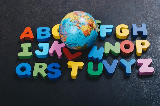 Abc wooden alphabet letters and globe for learning concept