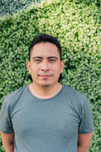 Photo aboriginal man in a gray t-shirt, looks into the camera for a photo