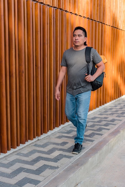 Aboriginal man outdoors with backpack