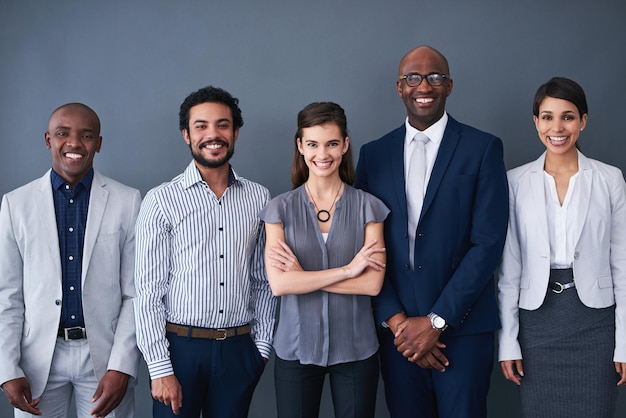 about us business people and row with smile in studio on grey background with pride portrait diversity and happy employees with confidence for teamwork or collaboration on career or company growth