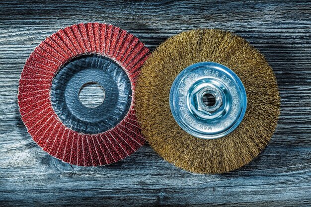 Abrasive disc wire brush on vintage wooden board.