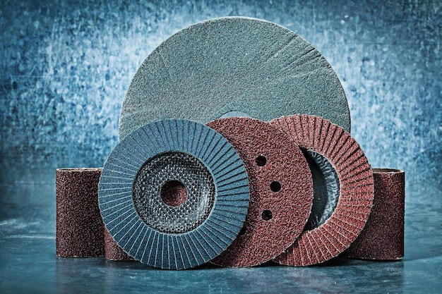 Abrasive discs and tapes on metalic background