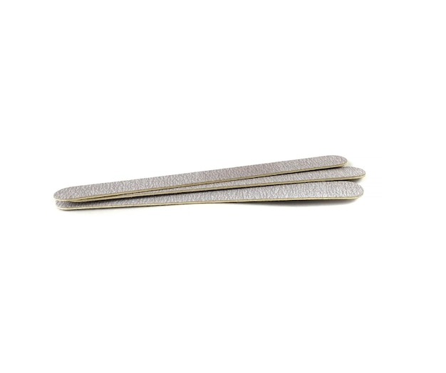 Abrasive nail files in close-up, isolated on a white background.