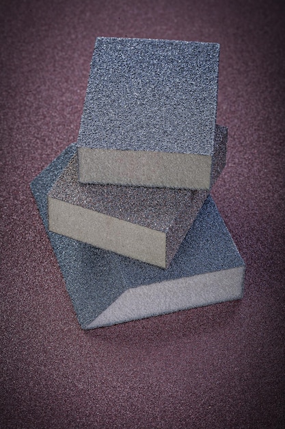 Abrasive sponges on emery paper vertical view.