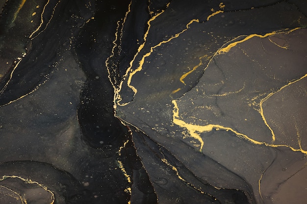 Abstarct fluid ink background with black and golden splashes