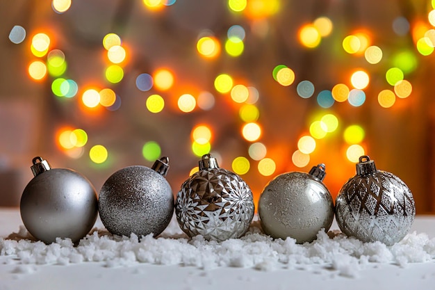 Abstract advent christmas background winter decorations ornaments balls on background with snow and ...