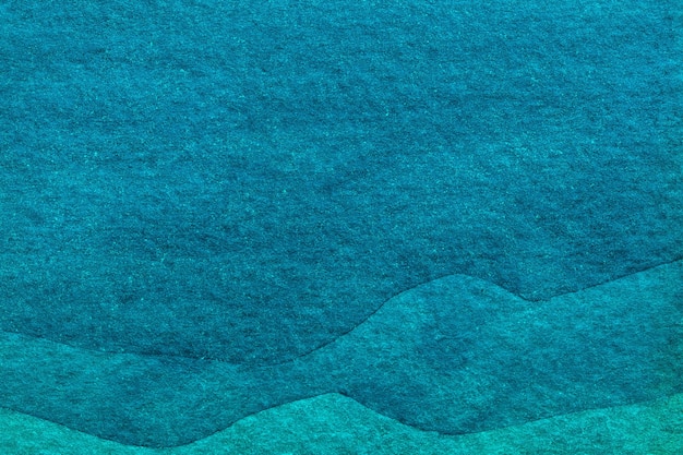 Абстрактное искусство фон синий и бирюзовый цвета. Акварельная живопись на холсте с рисунком воды голубых волн и градиентом.
