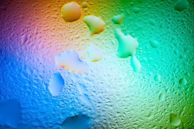 Абстрактный фон Абстрактное размытие изображения цветных мягких пятен и градиентов сквозь мокрое стекло