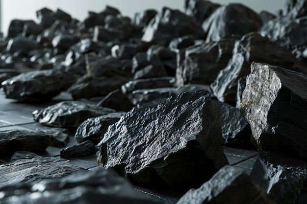 Photo abstract background of black stones in a row closeup