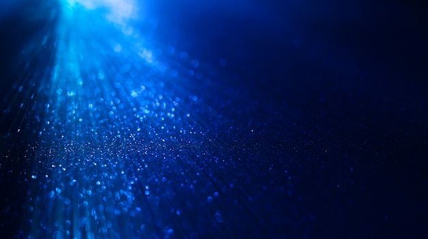 Photo abstract background of blue glitter lights defocused background banner size