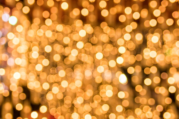 Abstract background bokeh of sparkling golden lights