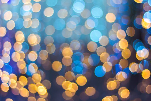 Abstract background bokeh of sparkling golden lights