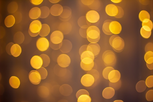 Abstract background bokeh of sparkling golden lights