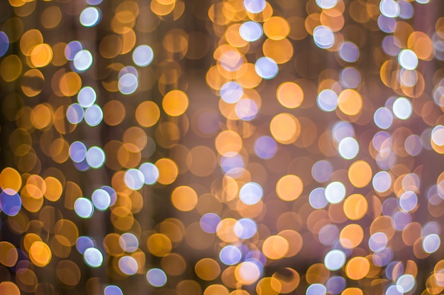 Abstract background bokeh of sparkling golden lights